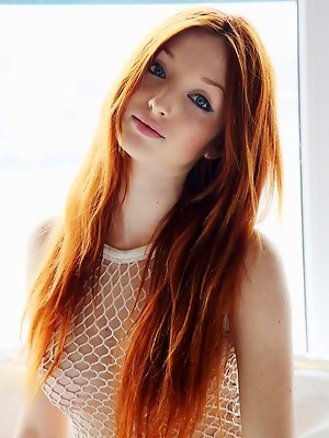 Micca displays her gorgeous body garbed in full body fishnet lingerie then strips her shorts and bares her delectable   assests. pics ~ SexyNakedModels.com